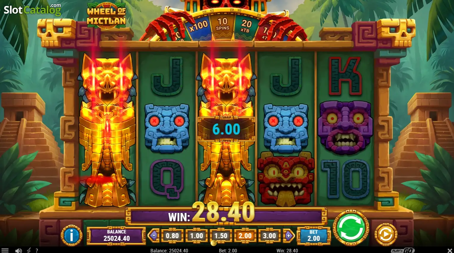 Wild Flip actif sur Wheel of Mictlan avec deux symboles Camazotz étendus sur les rouleaux